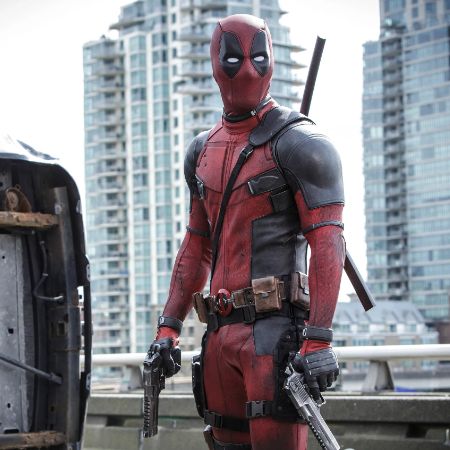 Deadpool holding guns in his hands.